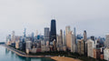 Chicago skyline with lake to left. Photo by Kelly: https://www.pexels.com/photo/skyscrapers-in-chicago-26821672/